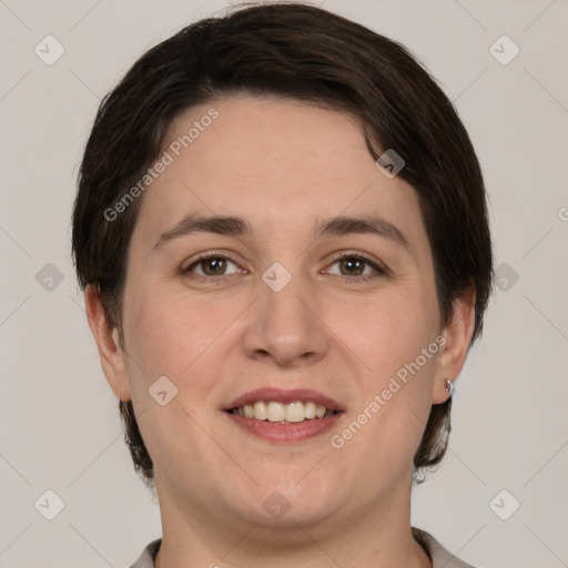 Joyful white adult female with short  brown hair and brown eyes