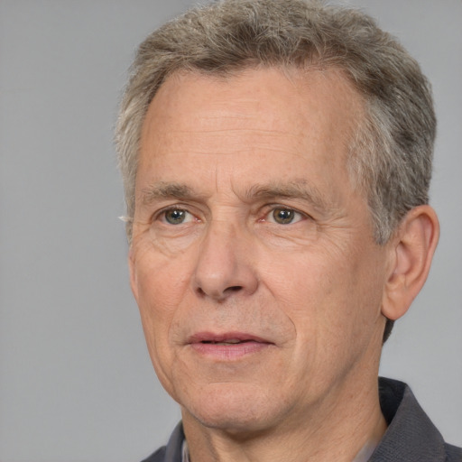 Neutral white middle-aged male with short  gray hair and brown eyes