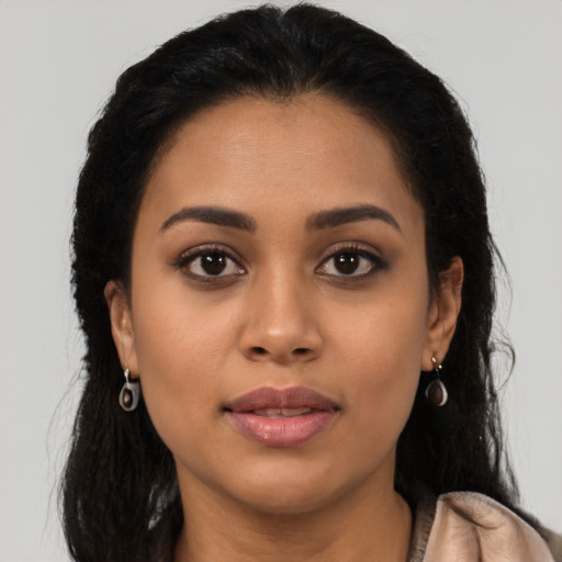 Neutral latino young-adult female with long  brown hair and brown eyes