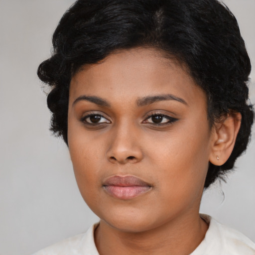 Neutral black young-adult female with medium  brown hair and brown eyes