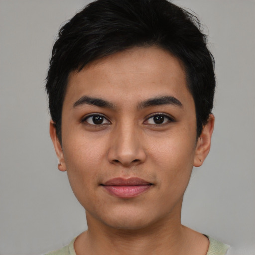 Joyful asian young-adult female with short  black hair and brown eyes