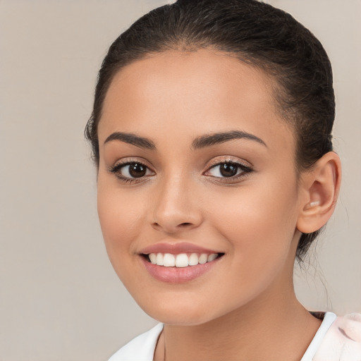 Joyful white young-adult female with medium  brown hair and brown eyes