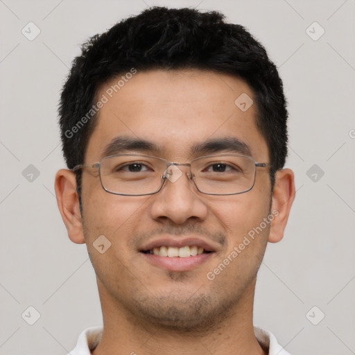 Joyful asian young-adult male with short  black hair and brown eyes