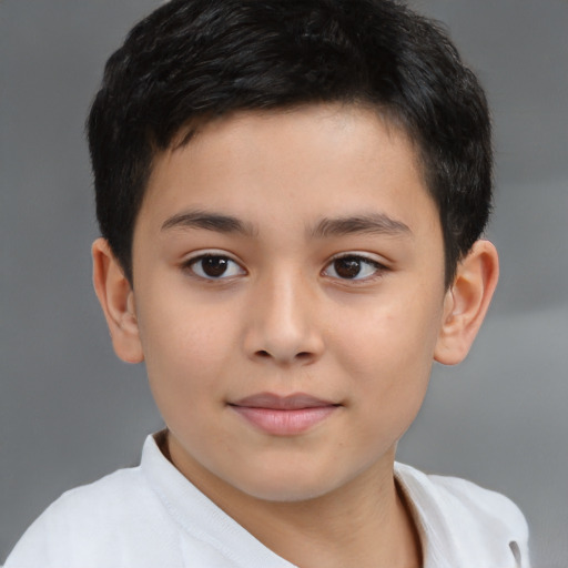 Joyful white child male with short  brown hair and brown eyes