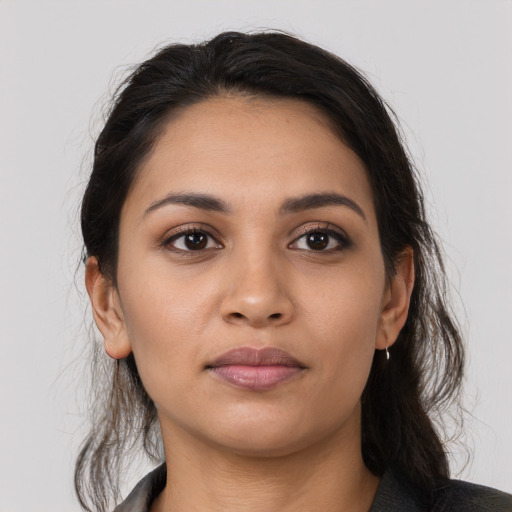Neutral latino young-adult female with medium  brown hair and brown eyes