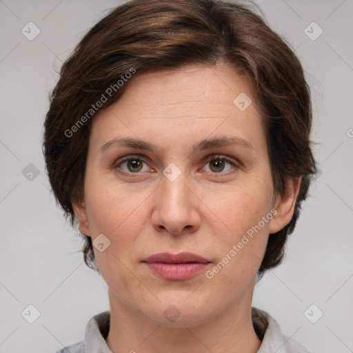 Joyful white adult female with short  brown hair and brown eyes