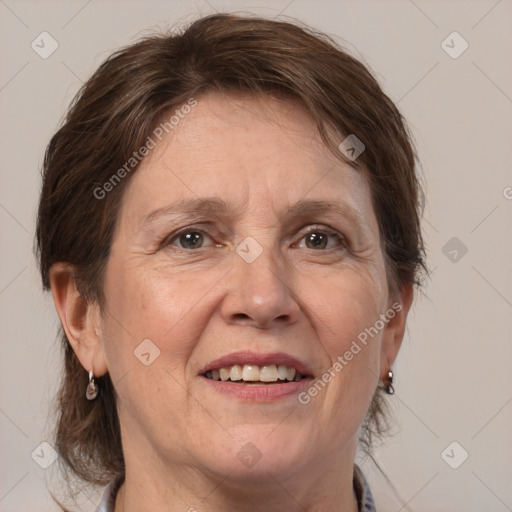 Joyful white adult female with medium  brown hair and grey eyes