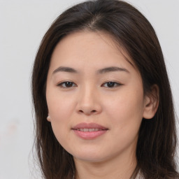 Joyful asian young-adult female with long  brown hair and brown eyes