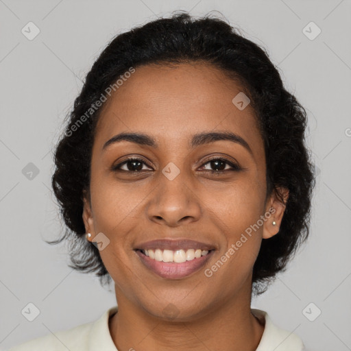 Joyful black young-adult female with long  brown hair and brown eyes