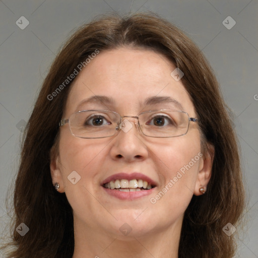 Joyful white adult female with medium  brown hair and blue eyes