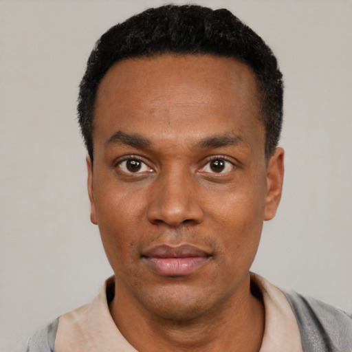 Neutral black young-adult male with short  black hair and brown eyes