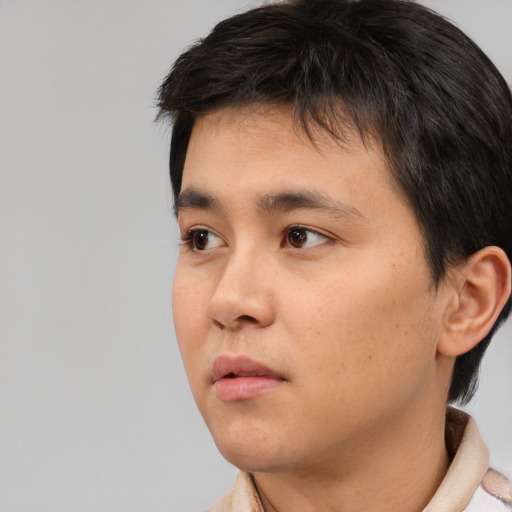 Neutral asian young-adult male with short  black hair and brown eyes