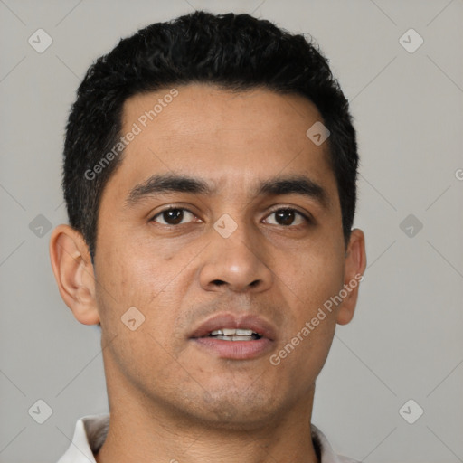 Neutral latino young-adult male with short  black hair and brown eyes