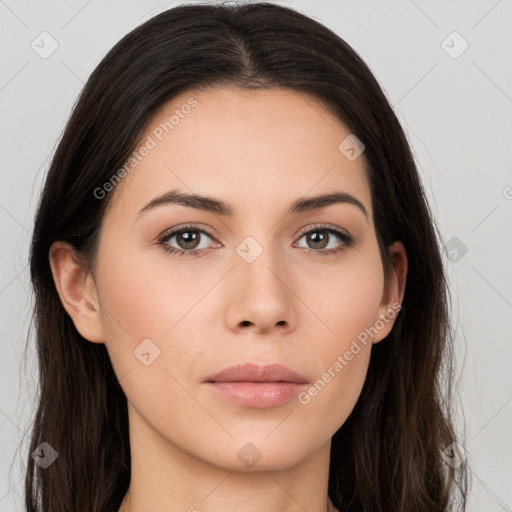 Neutral white young-adult female with long  brown hair and brown eyes