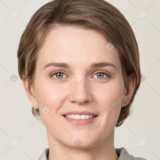 Joyful white young-adult female with short  brown hair and grey eyes