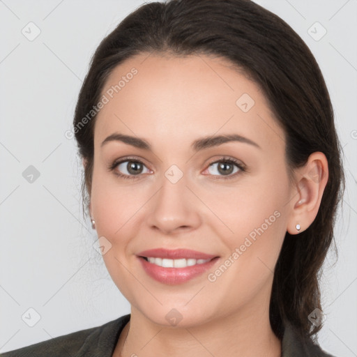 Joyful white young-adult female with medium  brown hair and brown eyes