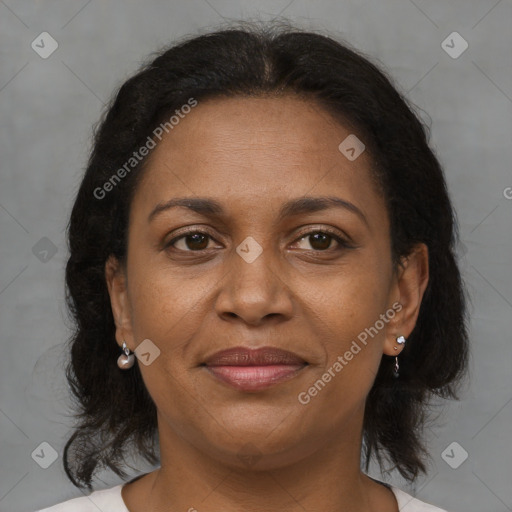Joyful black adult female with medium  brown hair and brown eyes