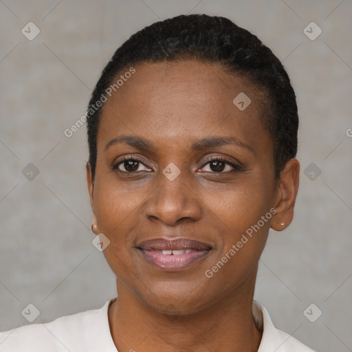 Joyful black young-adult female with short  black hair and brown eyes