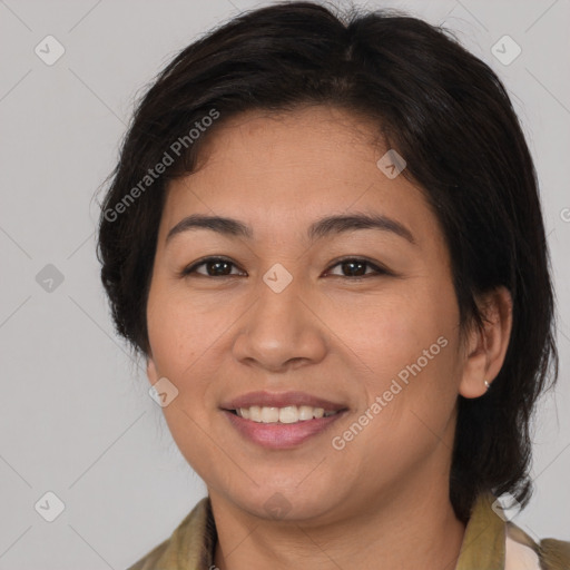 Joyful latino young-adult female with medium  brown hair and brown eyes