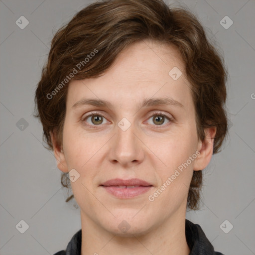 Joyful white young-adult female with medium  brown hair and green eyes