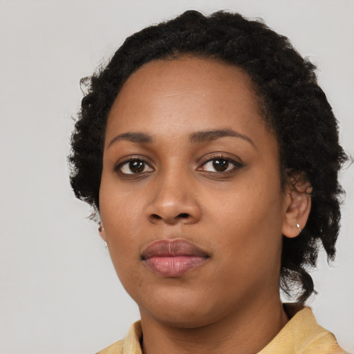 Neutral black young-adult female with long  black hair and brown eyes