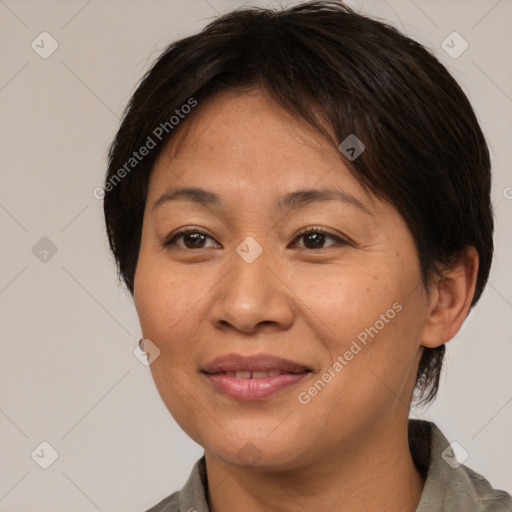 Joyful white adult female with short  brown hair and brown eyes