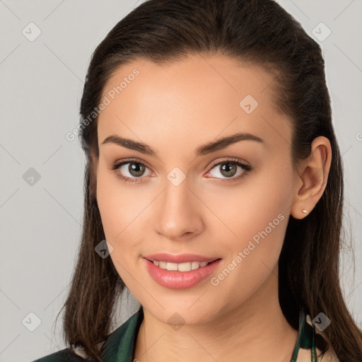 Joyful white young-adult female with long  brown hair and brown eyes