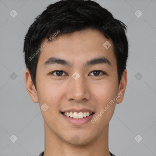 Joyful asian young-adult male with short  black hair and brown eyes