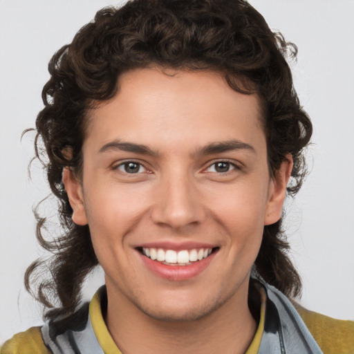 Joyful white young-adult male with medium  brown hair and brown eyes