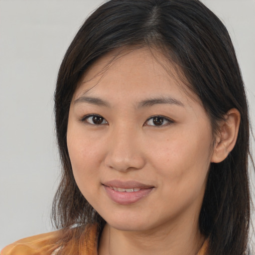 Joyful white young-adult female with medium  brown hair and brown eyes