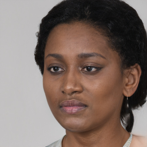 Neutral black young-adult female with short  black hair and brown eyes