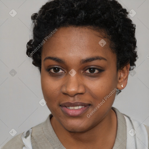 Joyful black young-adult female with short  black hair and brown eyes