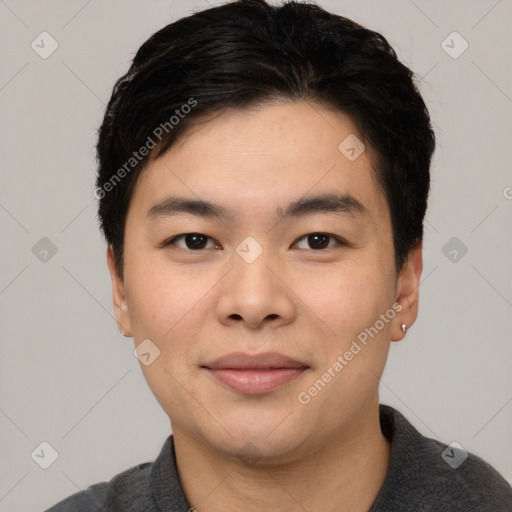 Joyful asian young-adult male with short  black hair and brown eyes