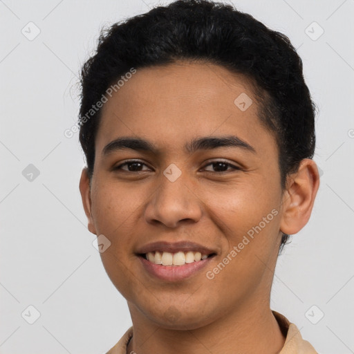 Joyful latino young-adult male with short  black hair and brown eyes