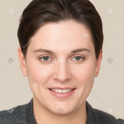 Joyful white young-adult female with short  brown hair and grey eyes