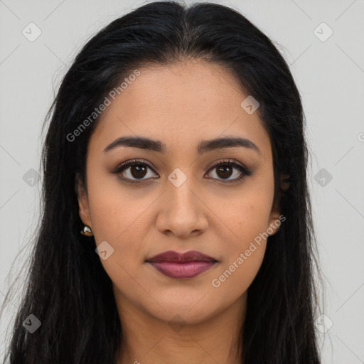 Joyful latino young-adult female with long  brown hair and brown eyes