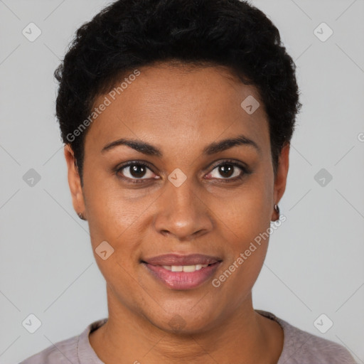 Joyful black young-adult female with short  black hair and brown eyes