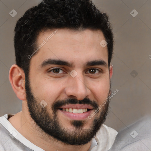 Joyful white young-adult male with short  black hair and brown eyes