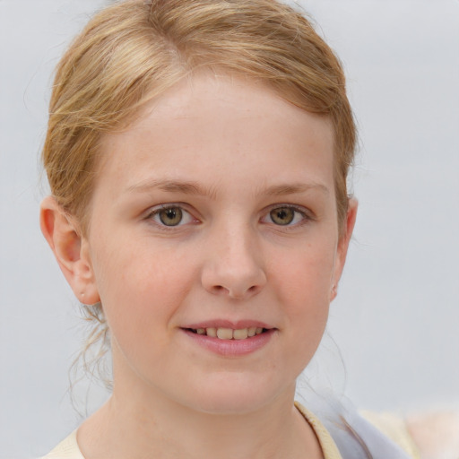 Joyful white child female with medium  brown hair and blue eyes