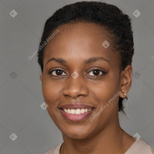 Joyful black young-adult female with short  brown hair and brown eyes