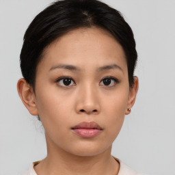 Neutral asian young-adult female with medium  brown hair and brown eyes