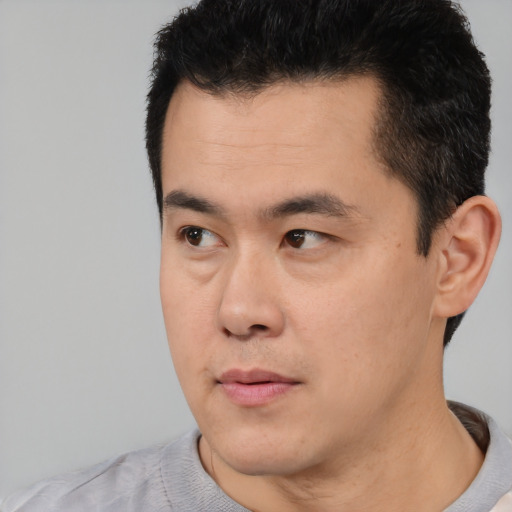 Neutral asian young-adult male with short  black hair and brown eyes