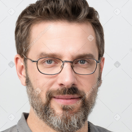 Joyful white adult male with short  brown hair and grey eyes