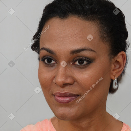 Joyful black young-adult female with short  brown hair and brown eyes