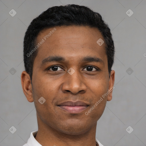 Joyful latino young-adult male with short  black hair and brown eyes