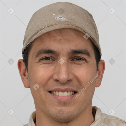 Joyful white adult male with short  brown hair and brown eyes