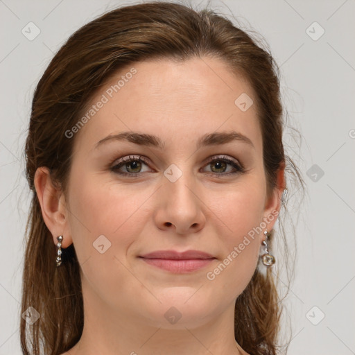 Joyful white young-adult female with medium  brown hair and green eyes