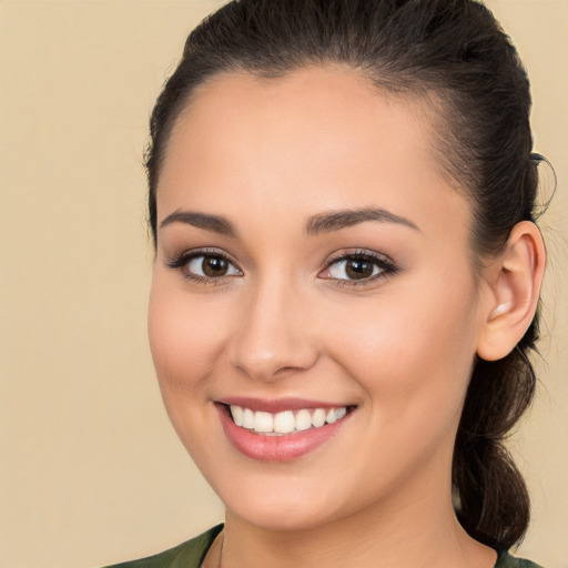 Joyful white young-adult female with long  brown hair and brown eyes