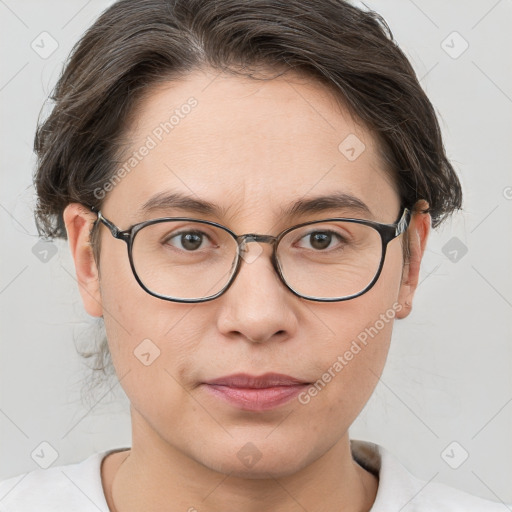 Joyful white adult female with short  brown hair and brown eyes