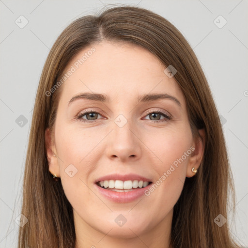 Joyful white young-adult female with long  brown hair and grey eyes